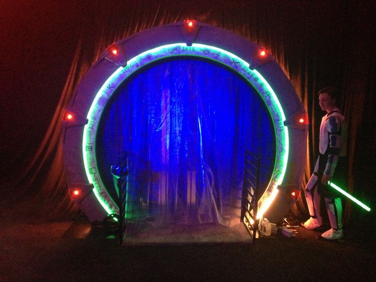 a man standing in front of a large circular stage