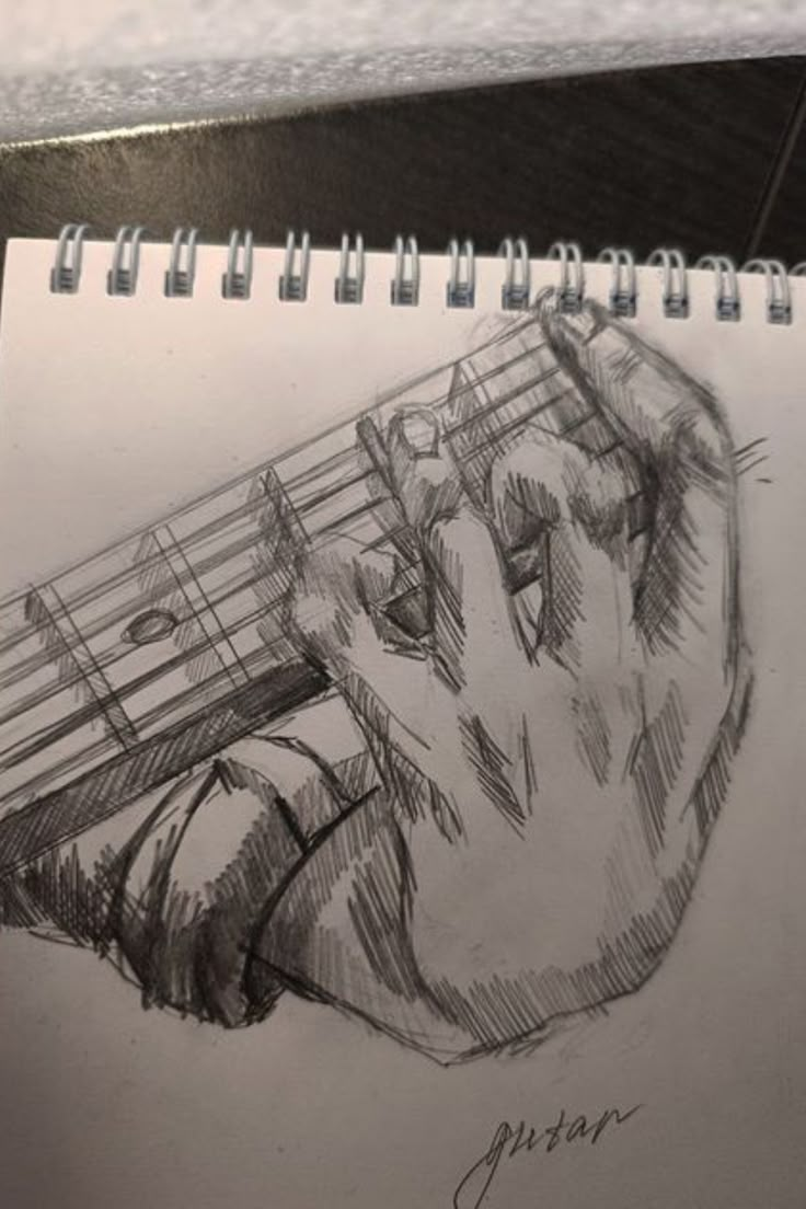 a pencil drawing of a person holding a guitar string with their hand on the strings