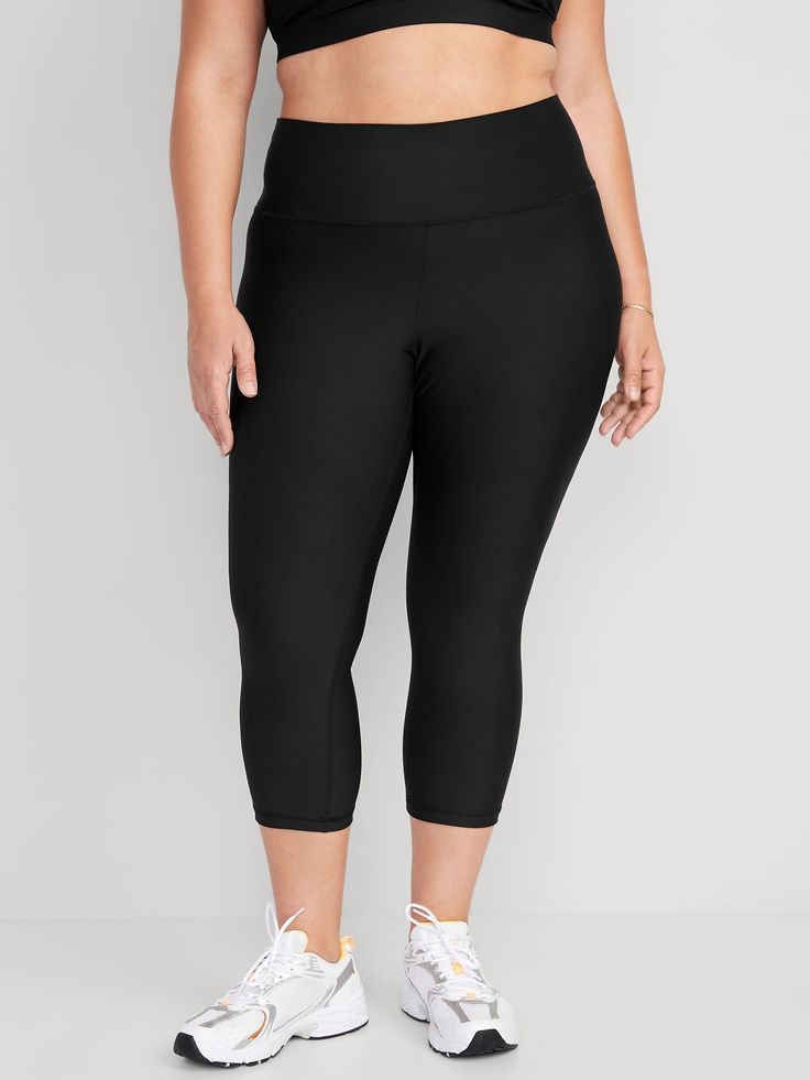 elasticized waist breathable go-dry wicks moisture sits at belly button fitted hits mid-calf 21" inseam models are approx.  5'9" and wear sizes s (4), l (12), and xl (18)machine wash according to the care instruction label Black Yoga Pants With 5-inch Inseam For Gym, Black Bottoms With Comfort Waistband For Pilates, Black Compression Leggings For Light Exercise, High Stretch Solid Color Capris For Sports, High Stretch Solid Color Sports Capris, Casual Black Go-dry Leggings, Gym Bottoms With 4-way Stretch In Capri Length, Gym Capri-length Bottoms With 4-way Stretch, Gym Capri Bottoms With 4-way Stretch