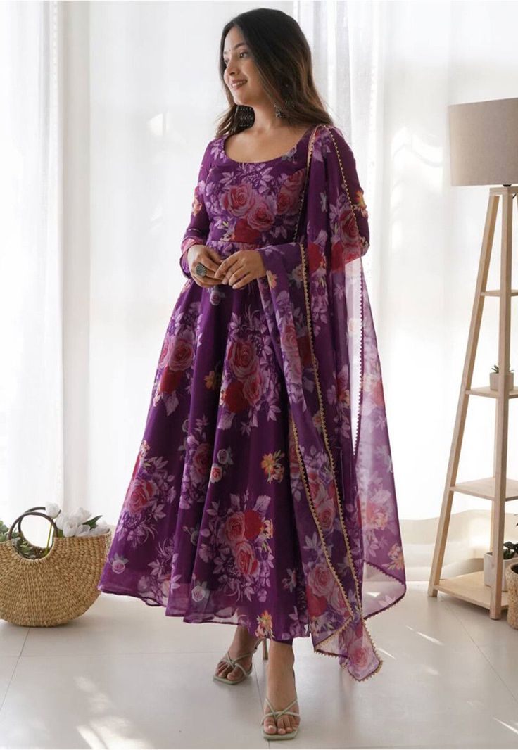 Readymade Organza Abaya Style Kameez in Purple This attire with Poly Shantoon Lining is Enhanced with Digital, Floral Print and Gota Lace Work. Crafted in Round Neck and Full Sleeve Available with a Lycra Leggings in Purple and a Organza Dupatta in Purple The Kameez and Bottom Lengths are 55 and 44 inches respectively Do note: Accessories shown in the image are for presentation purposes only and length may vary upto 2 inches.(Slight variation in actual color vs. image is possible). Organza Frocks For Women, Organza Frocks, Floral Print Anarkali, Georgette Anarkali, Gown With Dupatta, Reception Gown, Frock For Women, Anarkali Kurta, Printed Gowns