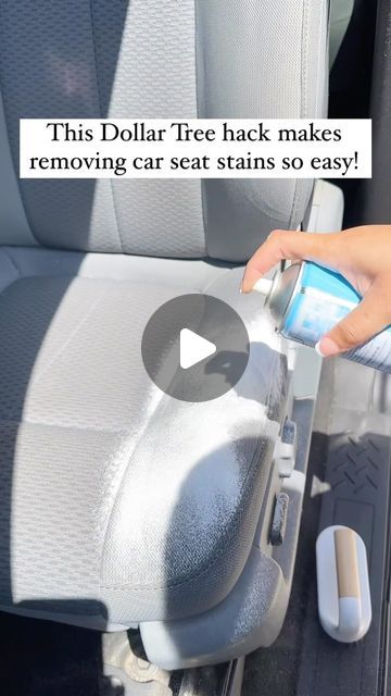 someone is using their cell phone to remove the seat cushions from the car's back