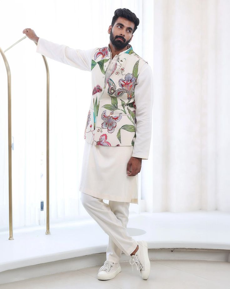 Embroidered Bandi JacketFrom Mahima Mahajan's Fida collection. DELIVERY TIMEPlease allow 6-8 weeks for your outfit to arrive. FABRIC DETAILSMoss Crepe, glace Cotton Professional cleaning only. Designer Cotton White Nehru Jacket, White Cotton Nehru Jacket For Designer Wear, Designer White Cotton Nehru Jacket, White Designer Sets With Embroidered Sleeves, Designer White Sets With Embroidered Sleeves, White Bandhgala For Spring Designer Wear, Designer Spring Nehru Jacket With Floral Embroidery, Spring Designer Nehru Jacket With Floral Embroidery, Designer Sets With Resham Embroidery For Spring