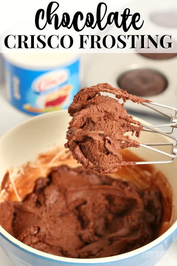 chocolate crisco frosting in a blue bowl with an ice cream scooper