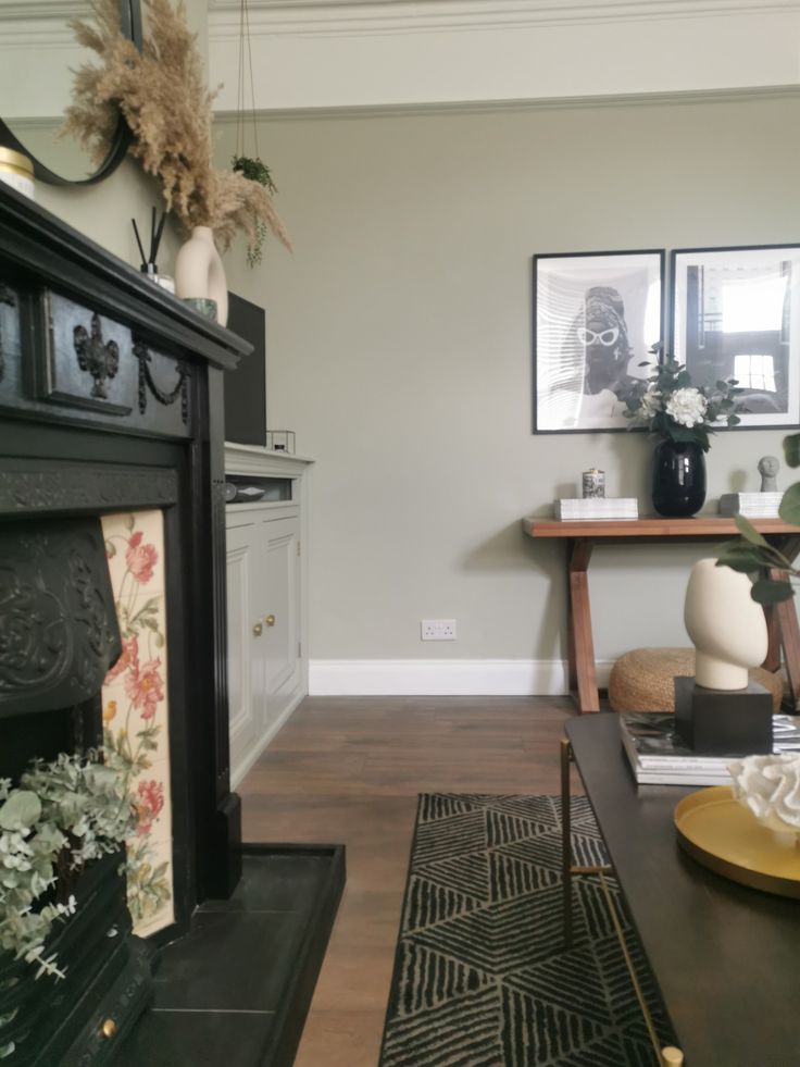 a living room filled with furniture and a fire place