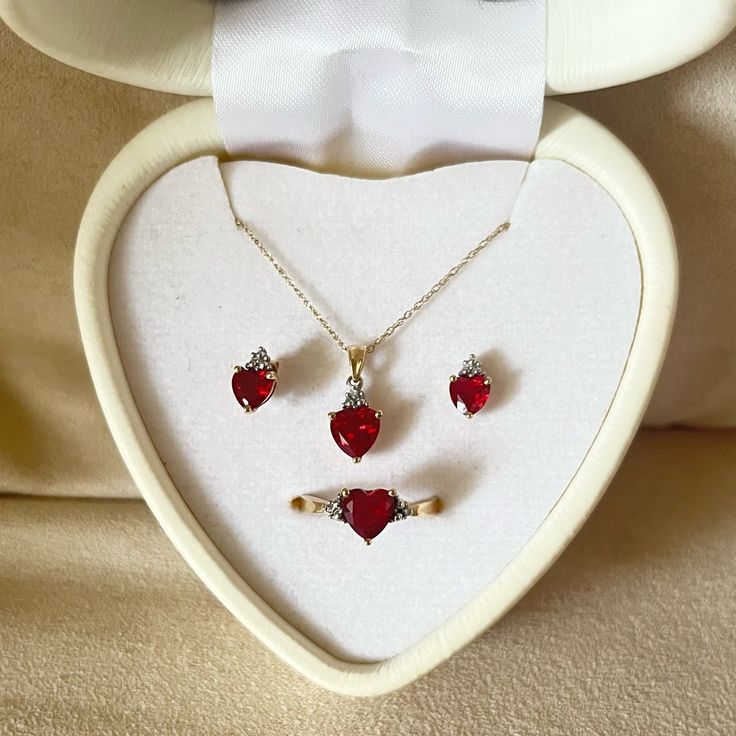 This Is A Heart-Shaped Jewelry Set. This Set Includes A Pair Of Beautiful Ruby Red Earrings, A Gorgeous Ruby Red Heart-Shaped Necklace On A Gold Chain And A 10k Gold Ring Topped With A Heart-Shaped Ruby With Diamonds. Dr Jewelry, Gold Jewelry Set, Ruby Heart, 10k Gold Ring, Heart Shaped Jewelry, Gold Jewelry Sets, Heart Shaped Necklace, Red Jewelry, Red Earrings