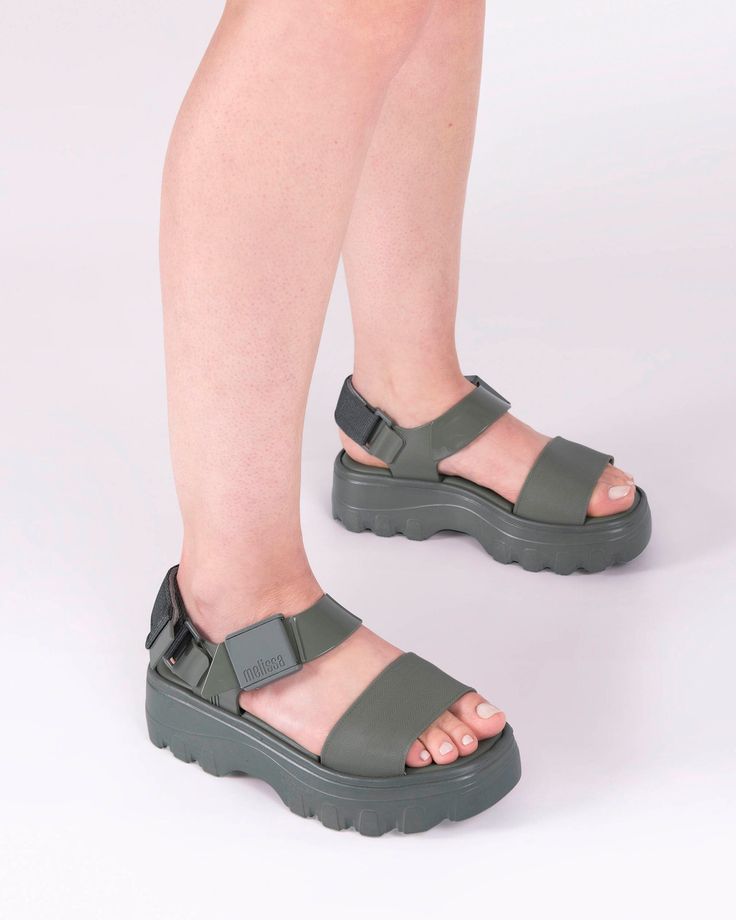 With reinvented soles and wide straps, the Kick Off Sandal has made it to the top, with a light and comfortable platform. The sandal presents a solid color palette and a version with transparent effect along with adjustable straps complete the sandal design. Trendy Synthetic Wedge Sandals With Adjustable Strap, Green Casual Sport Sandals With Adjustable Strap, Casual Footbed Sandals With Chunky Platform For Spring, Casual Green Sport Sandals With Adjustable Strap, Casual Chunky Platform Sandals In Synthetic, Trendy Synthetic Sandals With Adjustable Strap, Modern Sport Sandals With Chunky Platform, Casual Open Toe Footbed Sandals With Chunky Platform, Modern Synthetic Sport Sandals With Chunky Platform