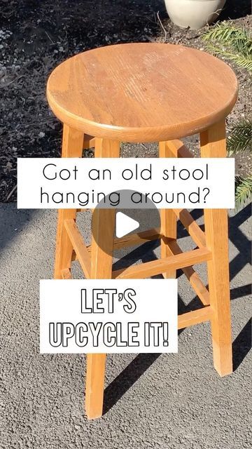 a wooden stool sitting on top of a sidewalk