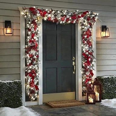 a front door decorated with christmas lights and decorations