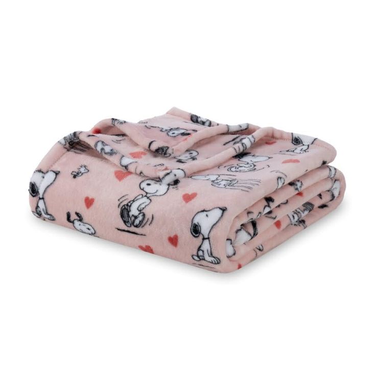 a pink blanket with snoopy dogs on it