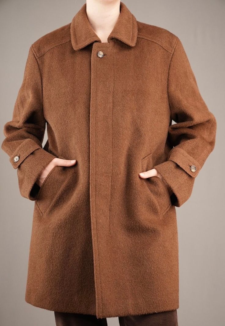 A beautiful male 90's coat by Valmeline. The warm brown wool fabric is similar to that of Loden coats, with slightly long and coarse fibers. It feels thick and sturdy, keeping you warm in those cold winter days. The inside checkered wool lining feels soft and not itchy at all. The coat is in mint condition, there are no damages whatsoever.  While it is a male coat, I would also recommend it to women that like a bit of an androgynous look. I am 175cm (5.9ft) tall and usually wear a female size M. Classic Brown Wool Coat With Button Closure, Brown Wool Pea Coat With Button Closure, Brown Buttoned Outerwear For Cold Weather, Brown Wool Coat With Button Closure, Brown Single-breasted Wool Coat, Brown Wool Business Outerwear, Brown Single-breasted Wool Coat For Winter, Single Breasted Brown Pea Coat For Winter, Brown Single-breasted Pea Coat For Winter