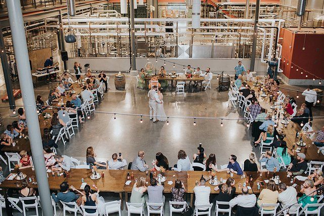 an overhead view of people sitting at tables in a large room with lots of windows