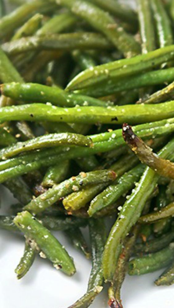 asparagus on a white plate with seasoning