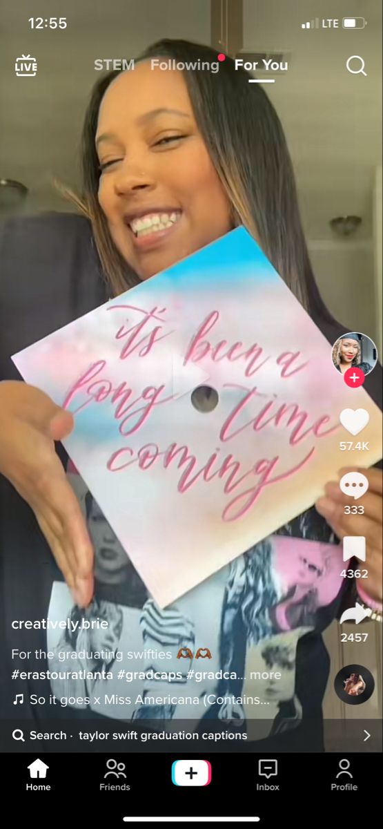 a woman holding up a sign that says it's been long gone coming out