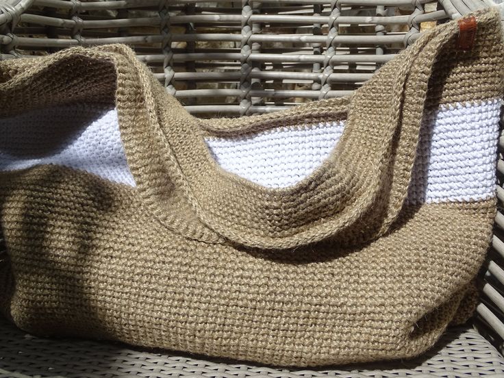 a purse sitting on top of a wicker basket