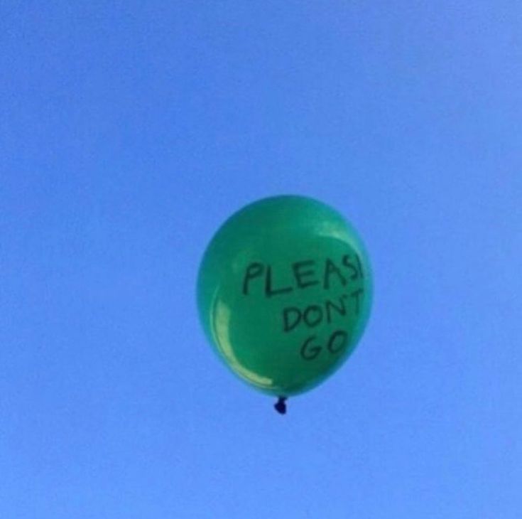 a green balloon that says please don't go in the sky with writing on it