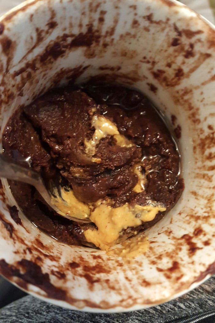 a white bowl filled with brownie and ice cream