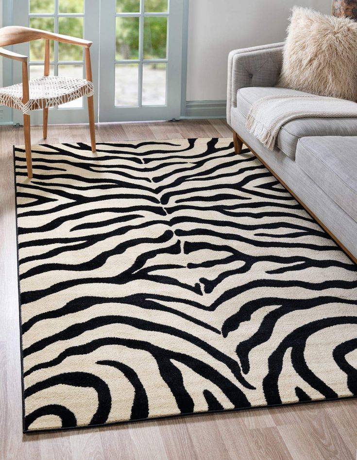 a black and white zebra print rug in a living room