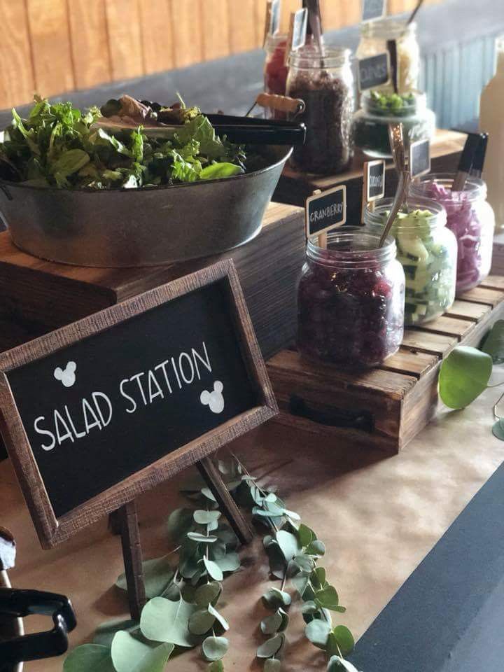 a salad station is set up on a table