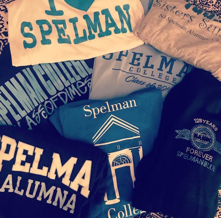 several t - shirts laying on top of each other with the words i love spellman