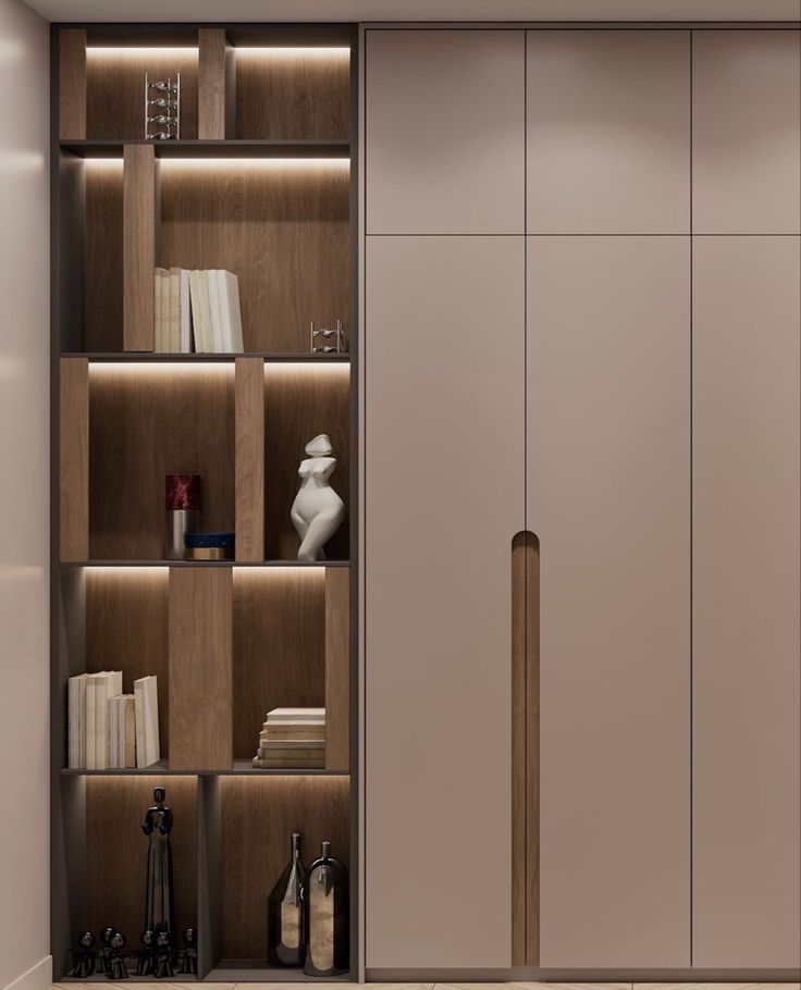 an open closet with books and other items on the shelves in front of it is illuminated by recessed lighting