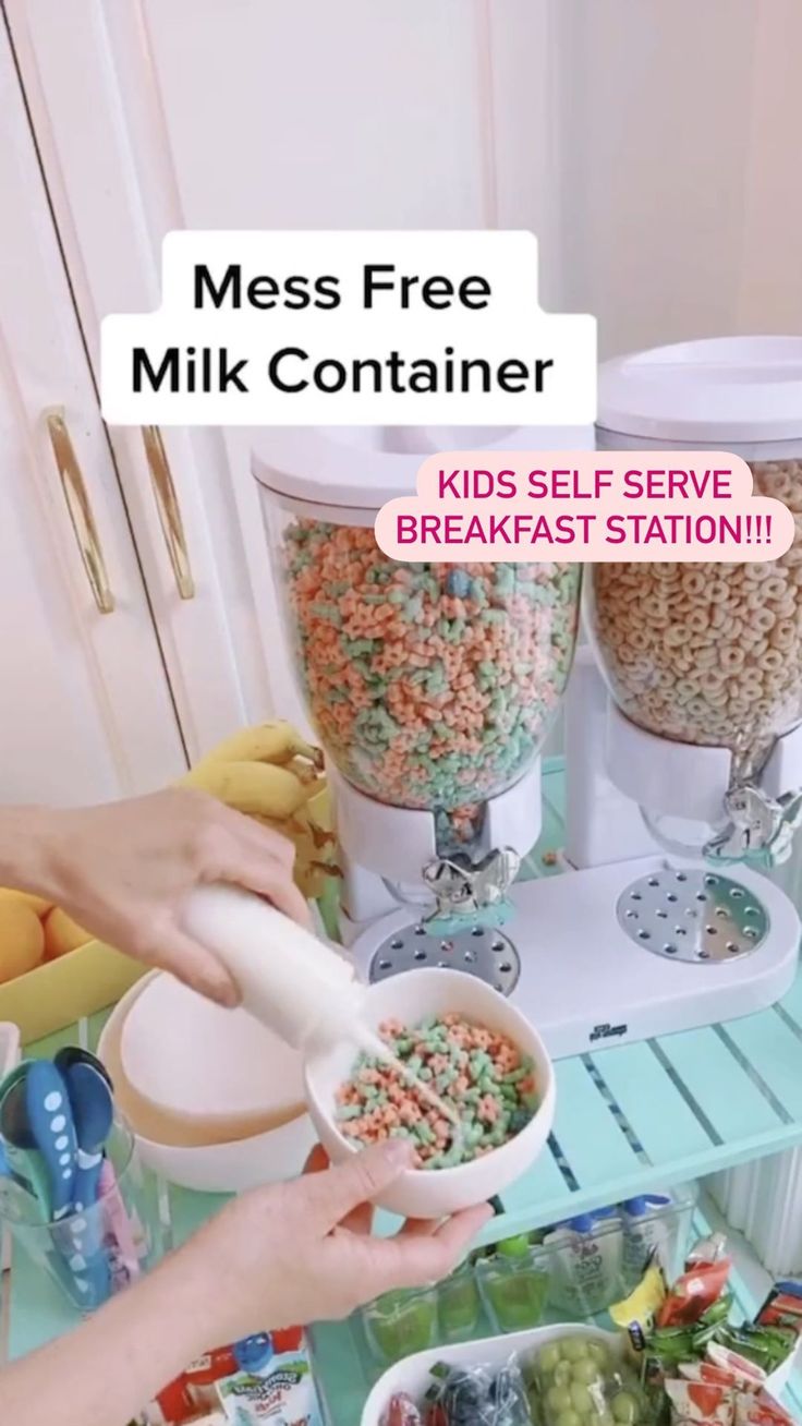 a person pouring cereal into a bowl on top of a counter next to other food items