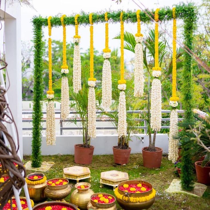 an outdoor area with potted plants and decorations