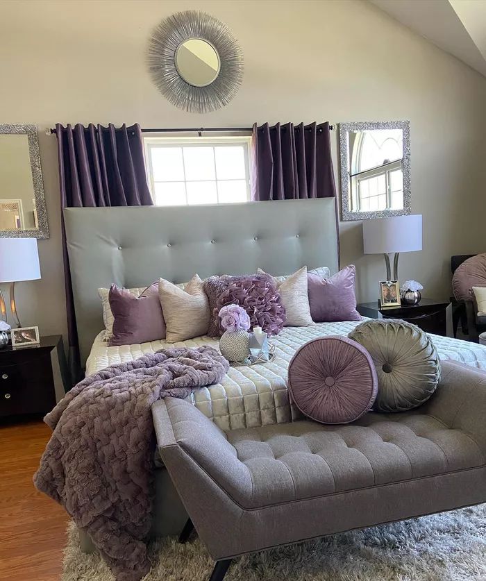 a large bed sitting in the middle of a bedroom