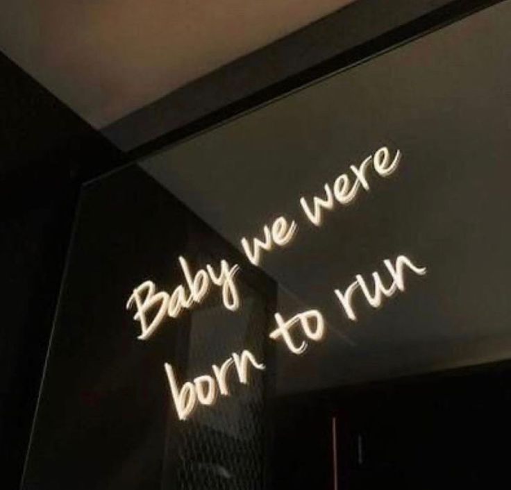 a neon sign that says baby we were born to run