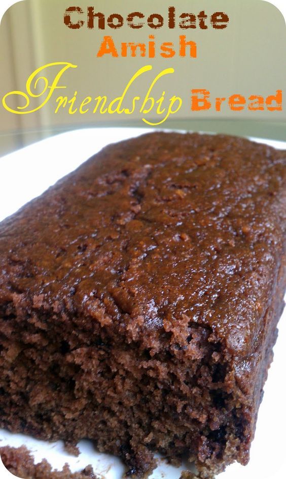 there is a piece of chocolate cake on the plate with words above it that read, chocolate amish friendly bread