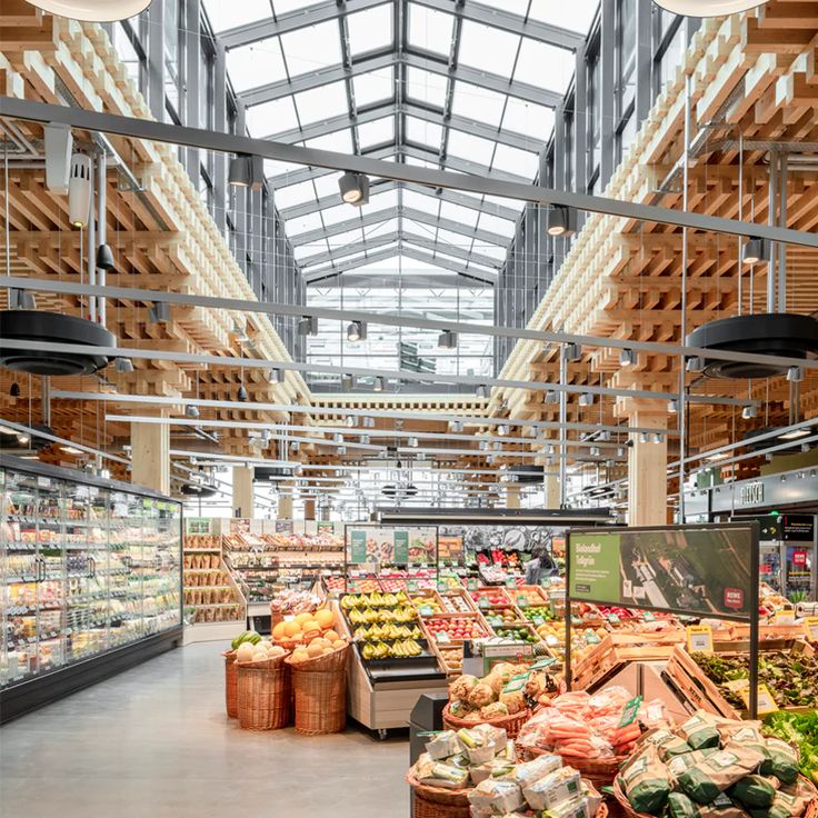 the inside of a grocery store filled with lots of fresh produce