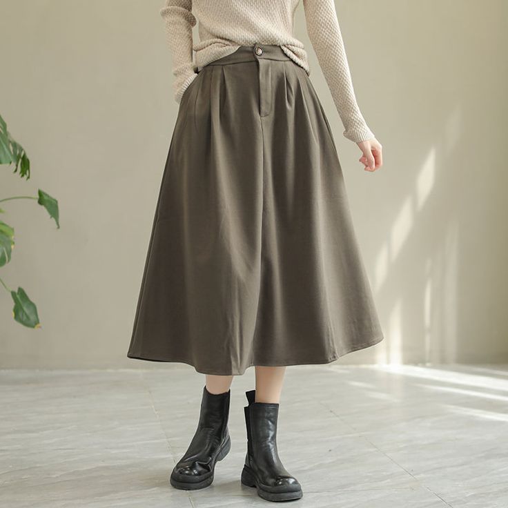 Details: Gender: Women Item Type: Skirt Material: Wool Season: Spring, Autumn Pattern: Solid Style: Casual, Loose, Retro Waist Type: Elastic Waist Size: One Size Waist: 64.00 - 84.00 cm/ 25.20 - 33.07 " Length: 77.00 cm/ 30.31 " Hip: 126.00 cm/ 49.61 " Hem: 184.00 cm/ 72.44 " Green Midi Skirt Bottoms For Winter, Casual Solid Color Winter Pleated Skirt, Winter Green Cotton Skirt, Winter Wide-leg Solid Color Skirt, Winter Wide Leg Solid Color Skirt, Casual Lined Khaki Skirt, Casual Khaki Lined Skirt, Green Long Skirt For Fall, Green Long Skirt Bottoms For Fall