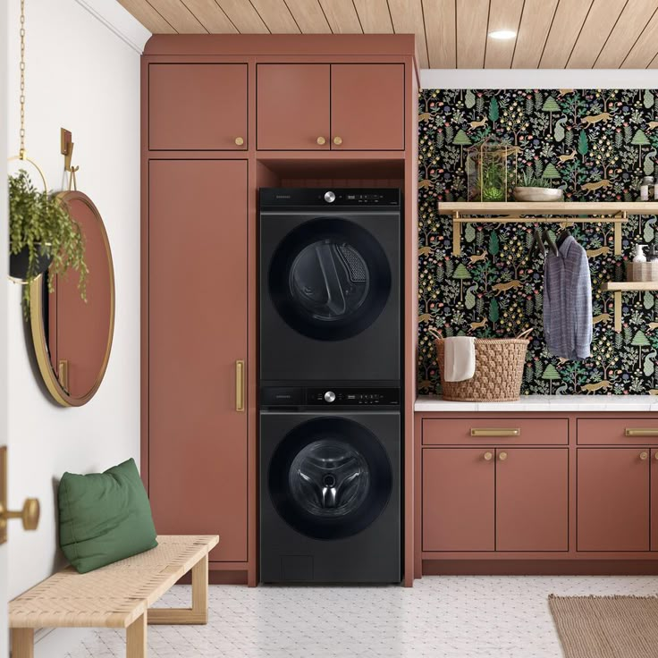 a washer and dryer are in the middle of a room with wallpaper