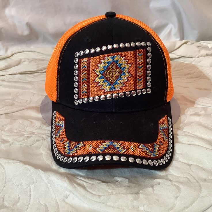 Nwot Western Adjustable Velcro Black / Orange/ Silver Studs Mesh Back Black Casual Snapback Hat For Festival, Orange One Size Fits Most Cap, Casual Black Snapback Hat For Festival, Southwestern Style Adjustable Beaded Hats, Orange Curved Brim Hat For Festivals, Black Trucker Hat For Festivals, Orange Cap, One Size Fits Most, Black Snapback Hat For Festival, Orange Brimmed Hat For Festival