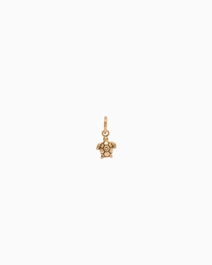 The Turtle Charm is handcrafted in 14K solid gold and features a detailed design inspired by sea turtles, celebrated as iconic symbols of the Caribbean. Playful yet sophisticated, this charm complements any look. Pair with your favorite hook bracelet or dainty chain, sold separately. Metal: 14K solid gold Dimensions: 9.5mm x 6mm x 2mm Style #: GC203S Elegant Yellow Gold Jewelry With Logo Charm, Elegant Starfish Charm Pendant Jewelry, Elegant Pendant With Starfish Charm, Elegant 14k Gold Jewelry With Logo Charm, Luxury Yellow Gold Jewelry With Vintage Charm, Elegant Rose Gold Jewelry With Logo Charm, 14k Rose Gold Jewelry With Flower Charm, Elegant 14k Yellow Gold Charms, Elegant Sterling Silver Jewelry With Starfish Charm