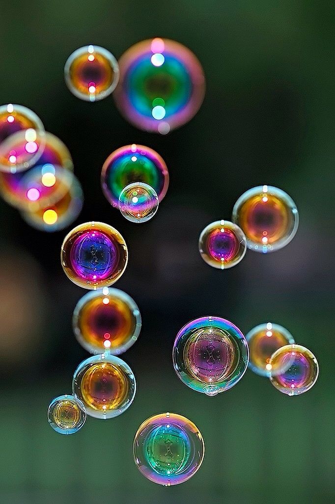 soap bubbles are floating in the air