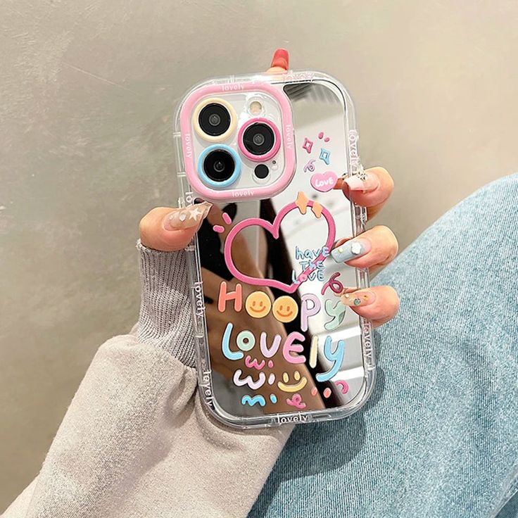 a woman holding up her phone case with the words hope and love on it