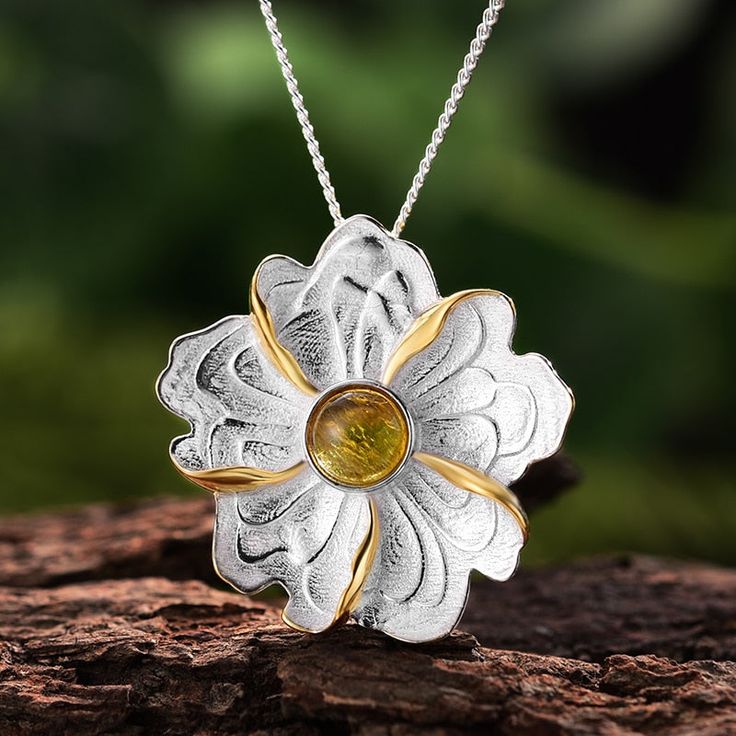 Introducing our Silver and Gold Peony Flower Pendant—a captivating piece of jewelry that combines the timeless elegance of a peony with the brilliance of a tourmaline gemstone. This pendant is a symbol of beauty, grace, and the vibrant colors of nature. **Product Highlights:** **Materials of Distinction:** - Crafted with precision and care, this pendant features a harmonious blend of sterling silver and gleaming 14k gold accents. The choice of metals ensures both durability and a radiant luster, Lotus Jewelry, Studded Necklace, Handmade Fine Jewelry, Tourmaline Pendant, Tourmaline Necklace, Peony Flower, Tourmaline Gemstone, Birthstone Necklace, Sterling Silver Bands