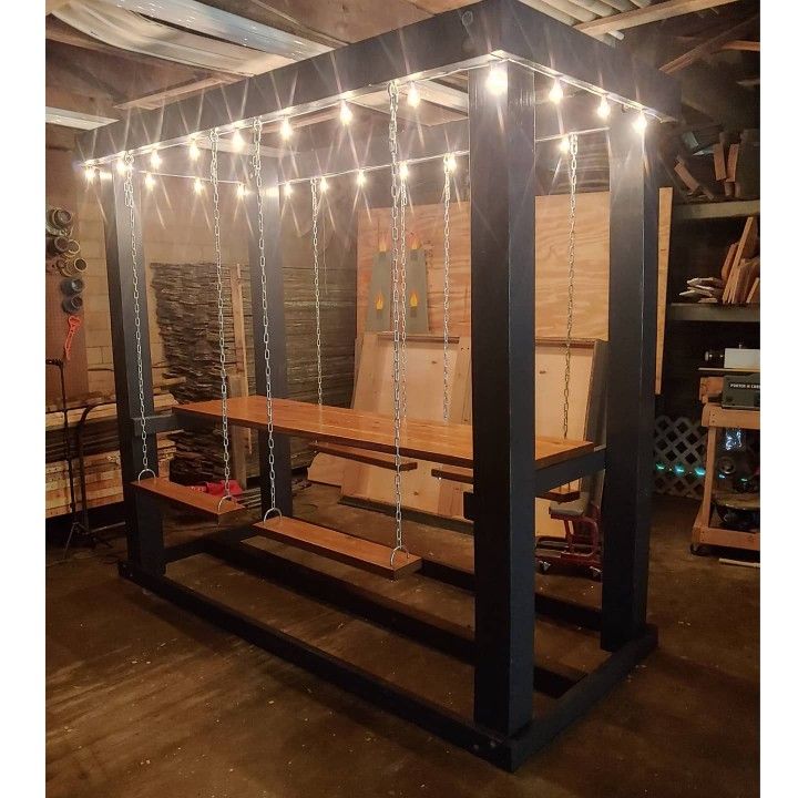 a room filled with lots of wooden furniture and string lights hanging from it's ceiling