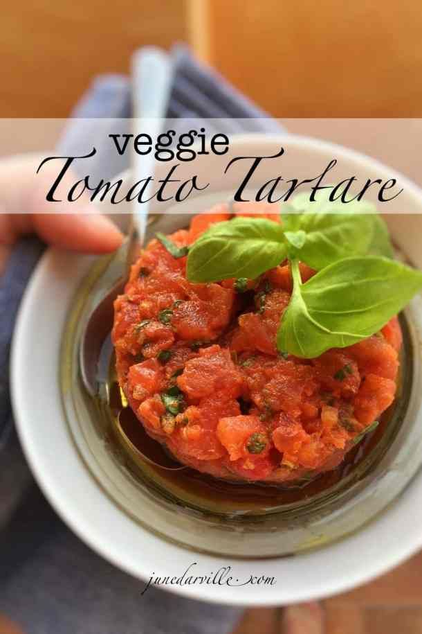 a person holding a white plate with food on it and the words veggie tomato tartare