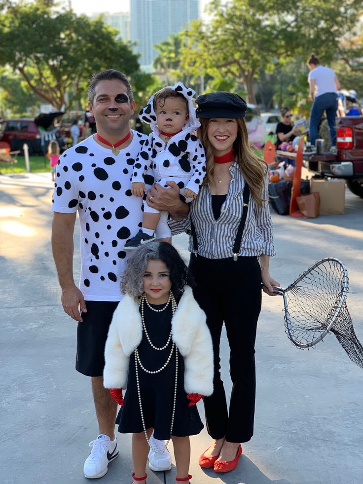 a man, woman and child dressed up in costumes