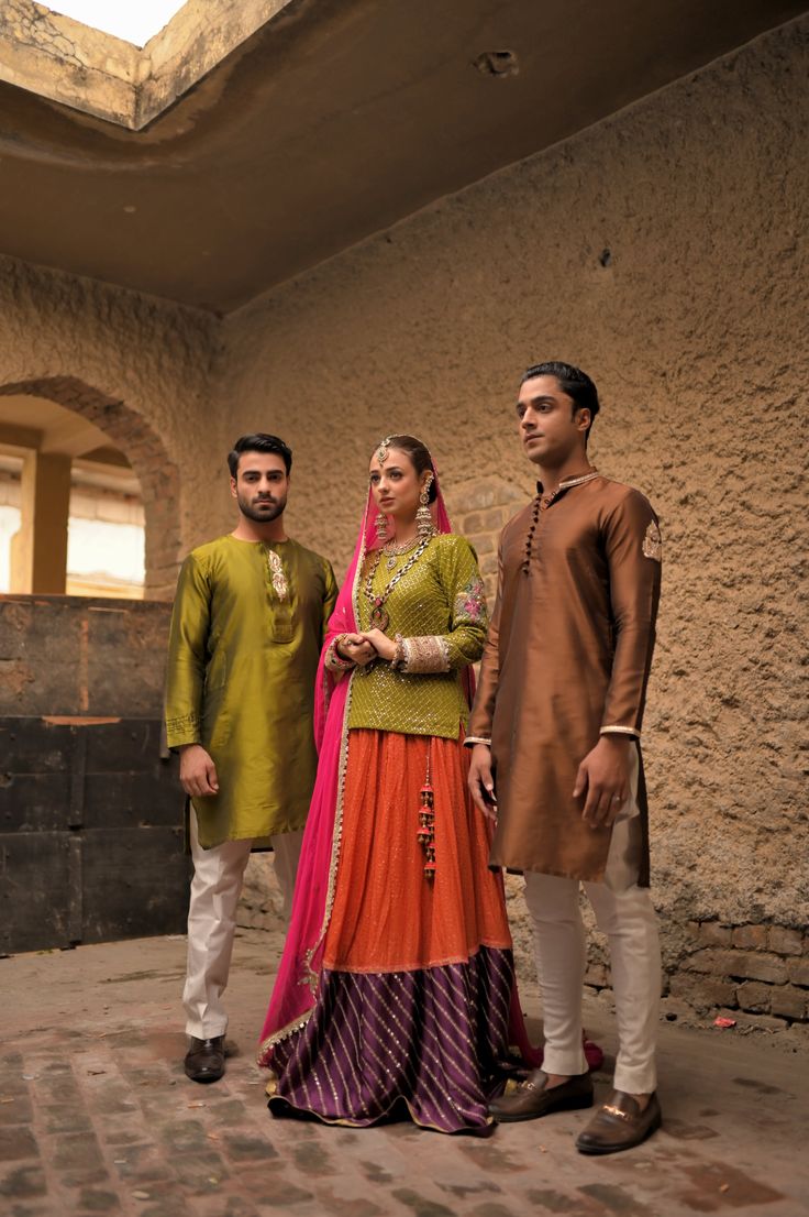 A brown silk kurta and fitted plain cotton silk pajama with gold embroidery on collar and sleeves and a matching motif on the arms, with round buttons to compliment the traditional look. Model wears a size Small. Traditional Chanderi Sherwani With Naqshi, Traditional Chanderi Kurta With Naqshi, Festive Cotton Silk Kurta With Naqshi Detail, Traditional Cotton Silk Wear With Naqshi For Diwali, Traditional Naqshi Cotton Silk Wear For Diwali, Raw Silk Long Sleeve Kurta With Dupatta, Sherwani With Dabka In Cotton Silk, Cotton Silk Sherwani With Dabka, Straight Kurta Style, Dabka Embellished Cotton Silk Sherwani