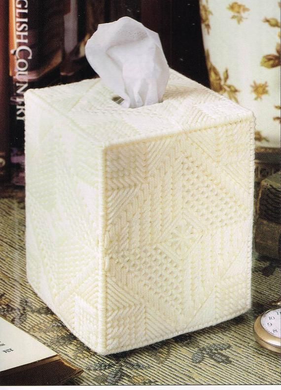 a tissue dispenser sitting on top of a table