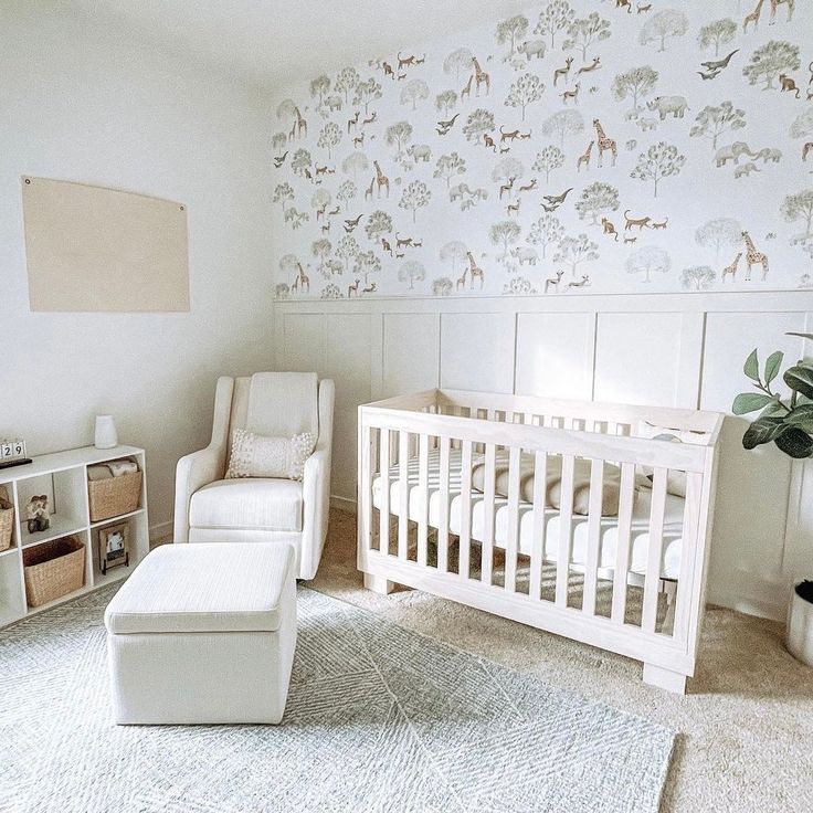 a baby's room with a white crib, rocking chair and toy chest