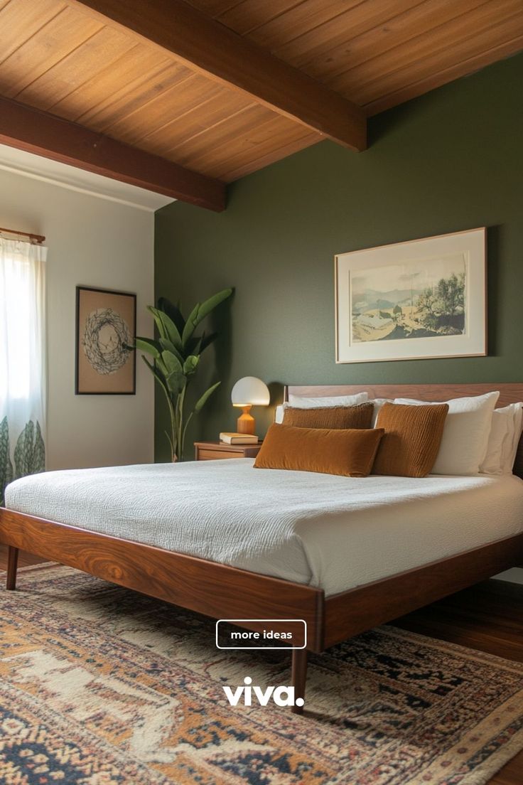 a bedroom with green walls and white bedding in the corner, along with a rug on the floor