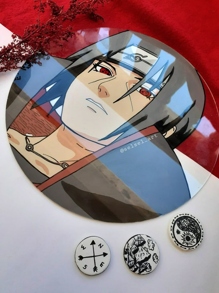 three buttons with anime characters on them sitting next to each other in front of a red background