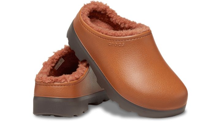 A modern and sophisticated alternative to the Classic Lined Clog, the Dylan Lined Clog offers cozy comfort in a stylish mule-style shoe. Made to mimic the look of genuine, full-grain leather mules, this lined version of the Dylan also features a rugged outsole for enhanced traction and versatility. Whether you’re lounging around home or running around town, you’ll enjoy the modern casual style, blissful comfort and great functionality.  Dylan Lined Clog Details:    Cozy lining for added comfort Comfortable Brown Mules For Outdoor, Comfortable Brown Outdoor Mules, Casual Brown Mules With Textured Sole, Comfortable Leather Clogs For Winter, Leather Slip-on Clogs For Winter, Winter Brown Mules With Rubber Sole, Brown Casual Clogs For Winter, Casual Synthetic Mules For Winter, Casual Brown Clogs For Winter