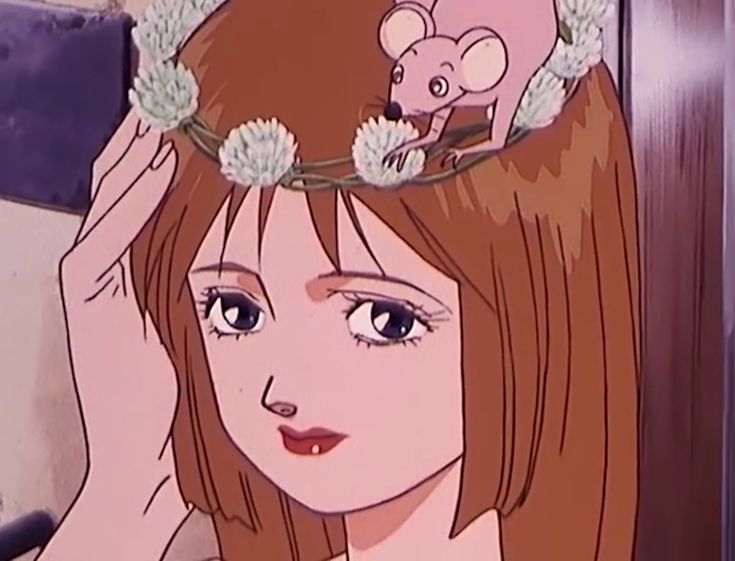 a girl with flowers in her hair and a mouse on top of her head