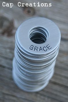 a spool of white thread sitting on top of a wooden table with the words cap creations