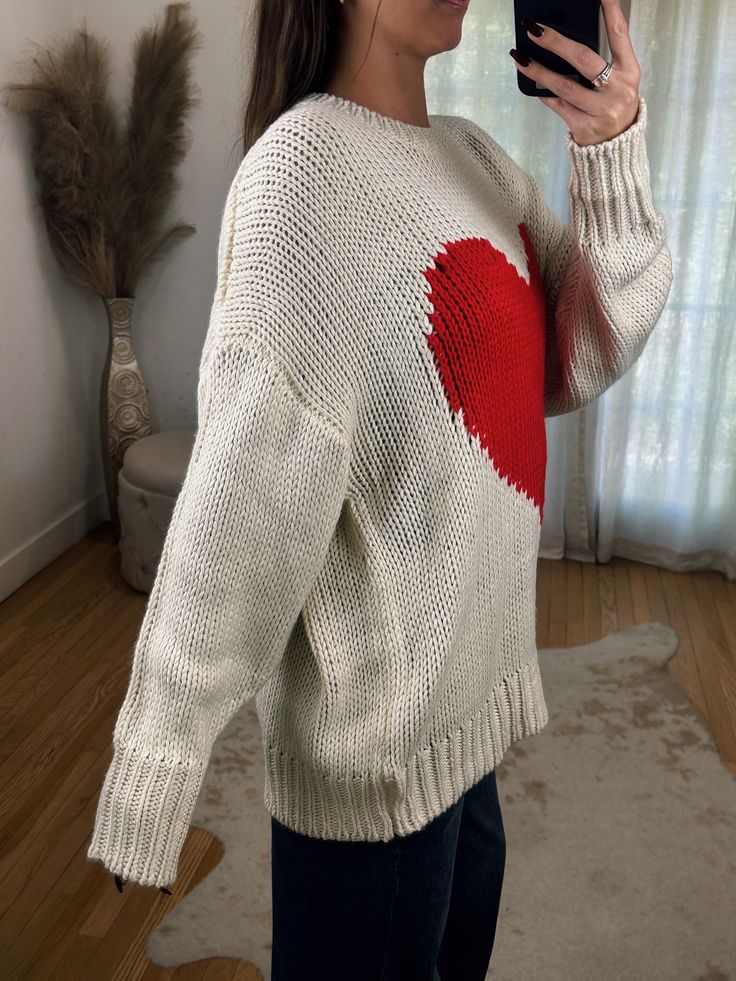 Adorable Oversized Off White Loose Knit Sweater ft. Big Red Heart Detail on Front. A great year round sweater but so adorable for Valentines day! Maclaine is 5'7 wearing a size SMALL. Model is 5’4 wearing a size LARGE. This has a naturally oversized fit! Loose Knit Sweater, Loose Knit Sweaters, Heart Sweater, Loose Knit, Big Heart, Maternity Clothes, Red Heart, Sweater Jacket, Sales Gifts