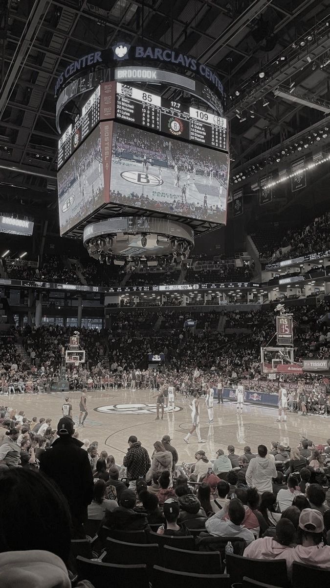 a basketball game is being played in an arena